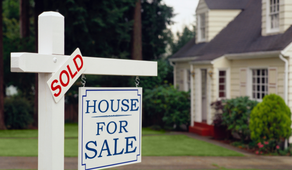 Buyer reviewing online home listing photos before scheduling a showing
