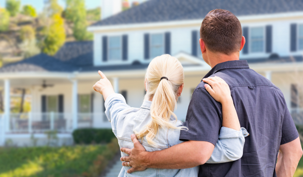 Real estate professional creating pricing strategy based on multiple home value factors Real estate professional creating pricing strategy based on multiple home value factors