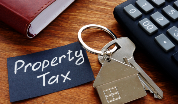 Home buyer reviewing property taxes, monthly housing costs, and homeownership expenses in Anne Arundel County Maryland Home buyer reviewing property taxes, monthly housing costs, and homeownership expenses in Anne Arundel County Maryland