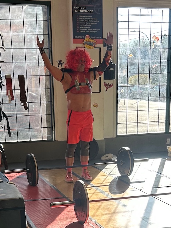 WOD Father preparing for a barbel lift