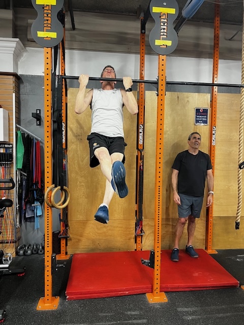 Empower member Doc Disk at the pull up bar Empower member Doc Disk at the pull up bar