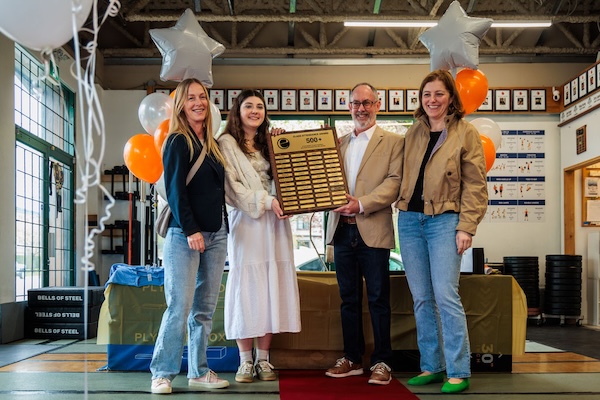 500 classes members receiving their award