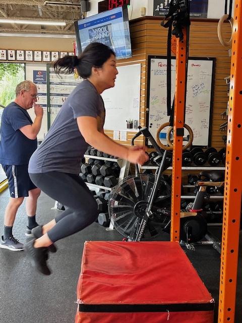 Empower member Peril doing box jumps Empower member Peril doing box jumps