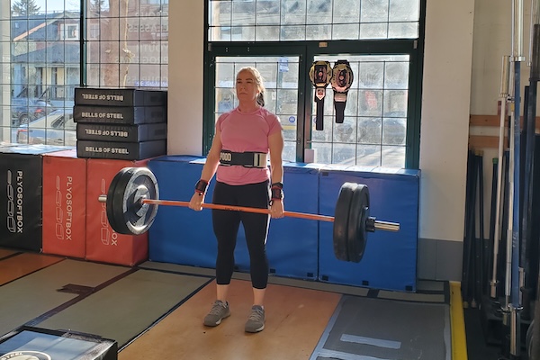 Barbell deadlifts at Empower Fitness