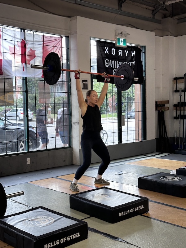 Empower member Pepper doing a barbell lift