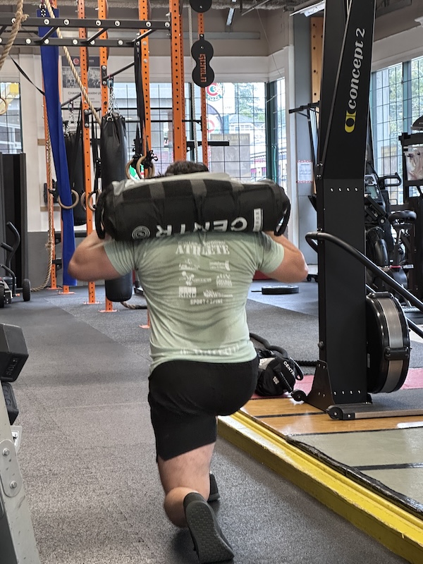 Coach Bobo doing weighted lunges