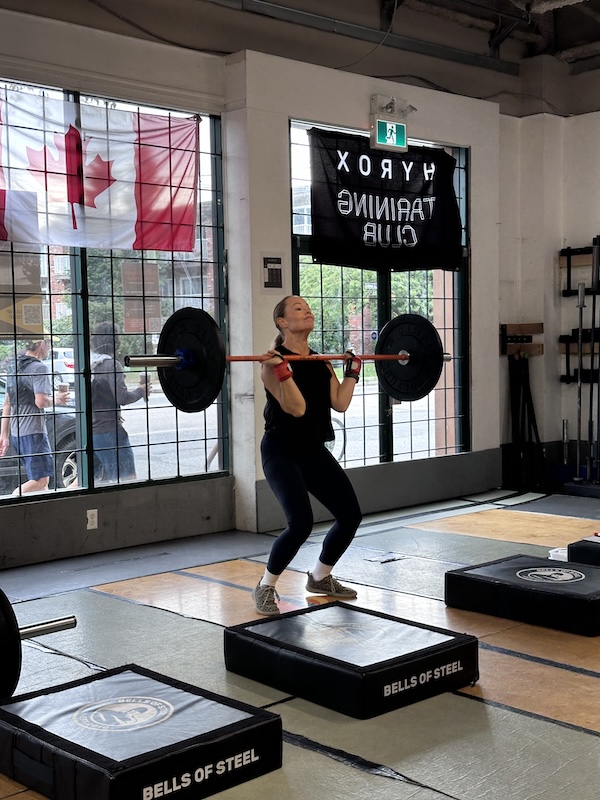 Empower member Pepper lifting barbell