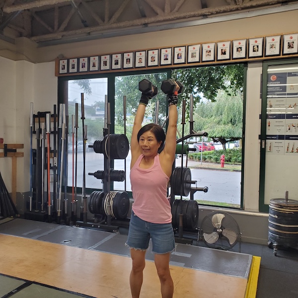 Empower CrossFit group class - dumbbell shoulder press Empower CrossFit group class - dumbbell shoulder press