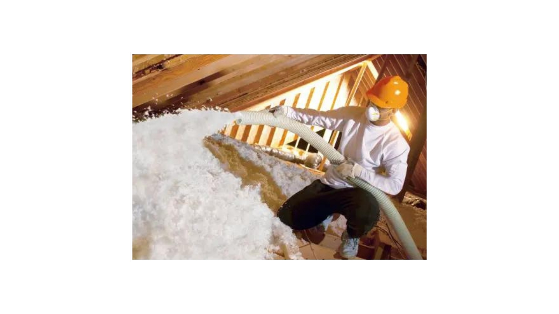 Carney Construction installer blowing attic insulation