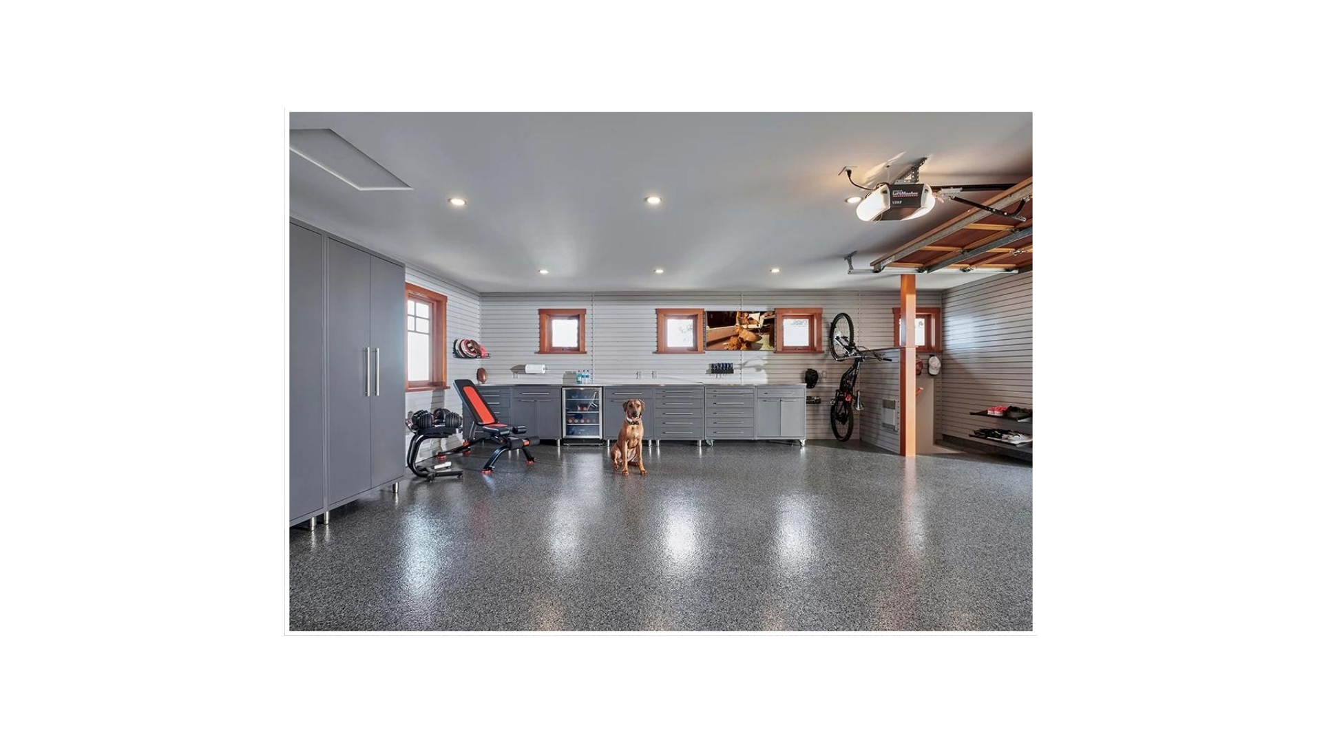 Finished garage remodel with custom shelving and epoxy floor