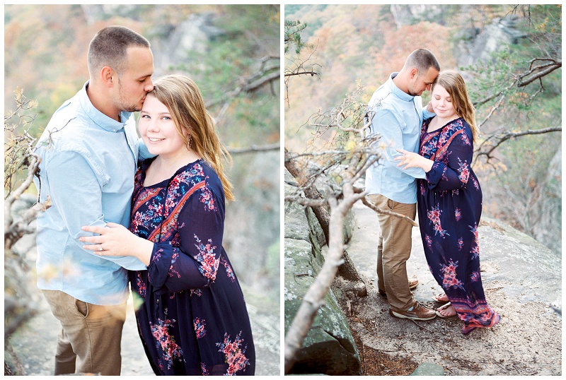 Chattanooga engaged couple smiling at the camera in front of sunset rock.