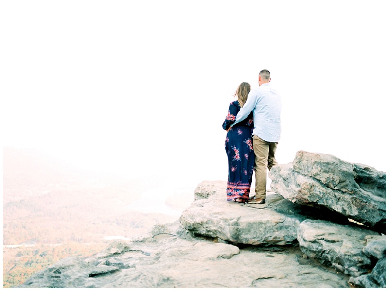 Engaged couple overlooking sunset rock in Chattanooga TN.