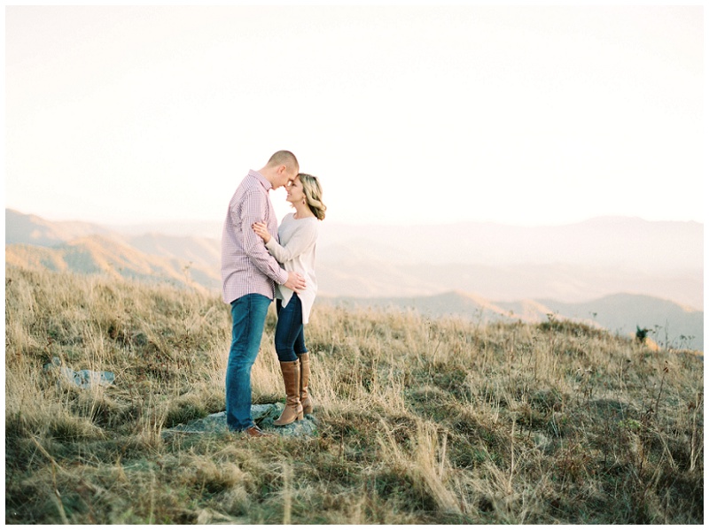 Couple embracing each other while enjoying the scenic view on top of Roan Mountain.
