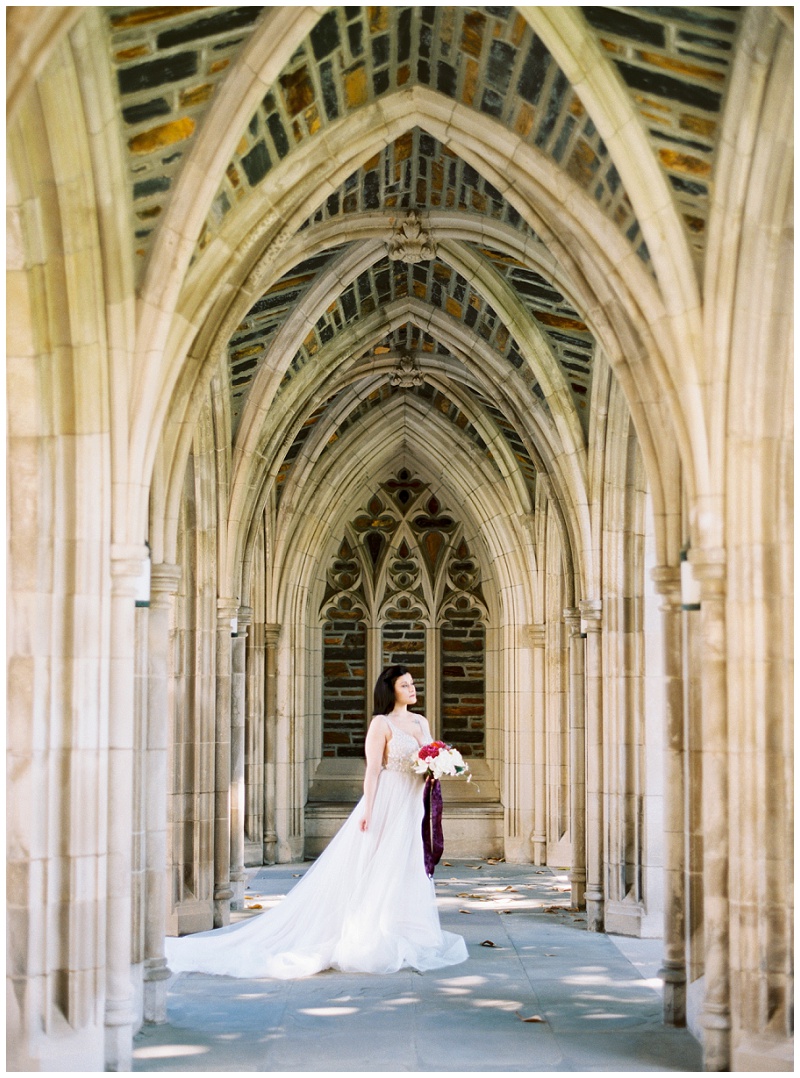 Bride standing in front of Duke University Chapel in Durham NC for wedding portraits