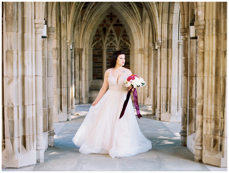 Duke University Chapel wedding portrait with bride in flowing gown on campus