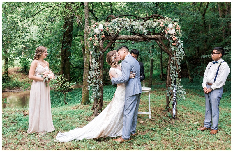 Bride and groom first kiss at the ceremony