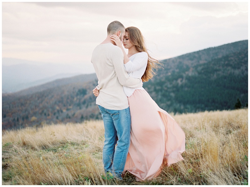 Bride-to-be looking at fiancé during Roan Mountain TN engagement photos