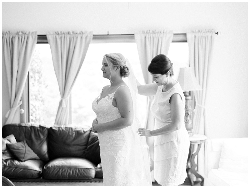 Bride with mom getting ready the morning of her wedding