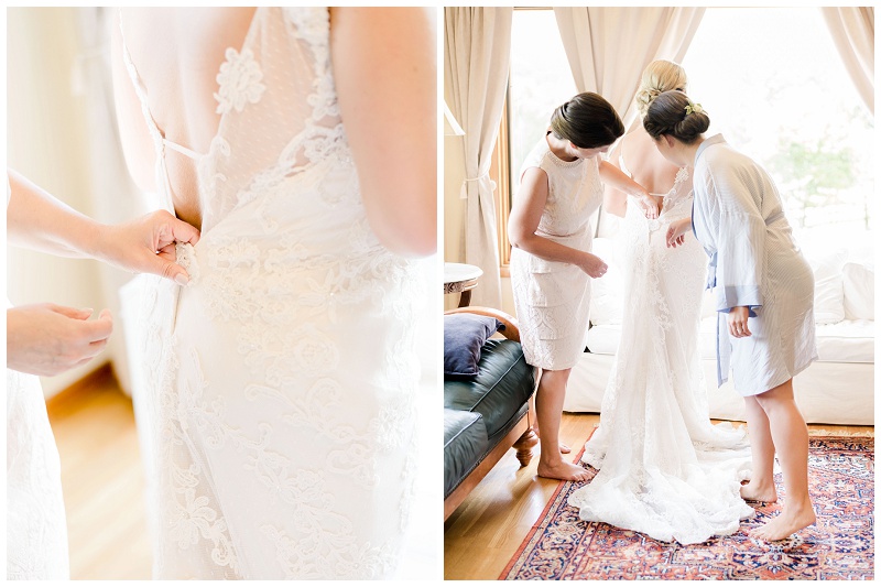Bride getter help putting on her wedding dress
