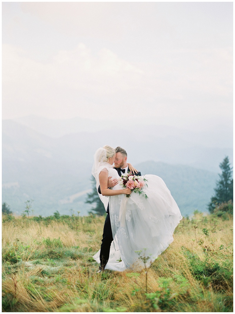 Josh and Megan walking hand in hand at Roan Mountain TN