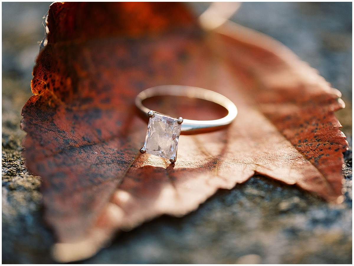 Intimate fall engagement session with up close detail of ring 