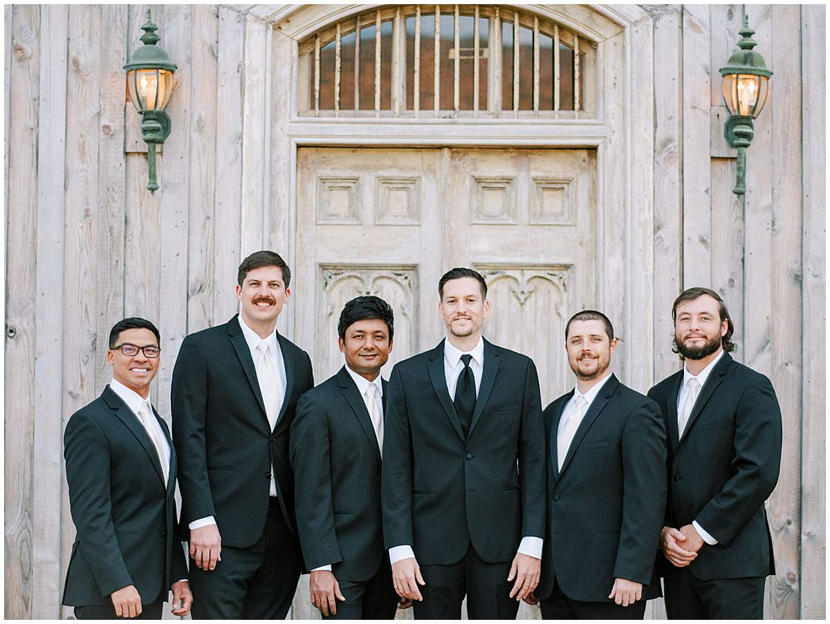 Groomsmen in suits at outdoor Virginia wedding