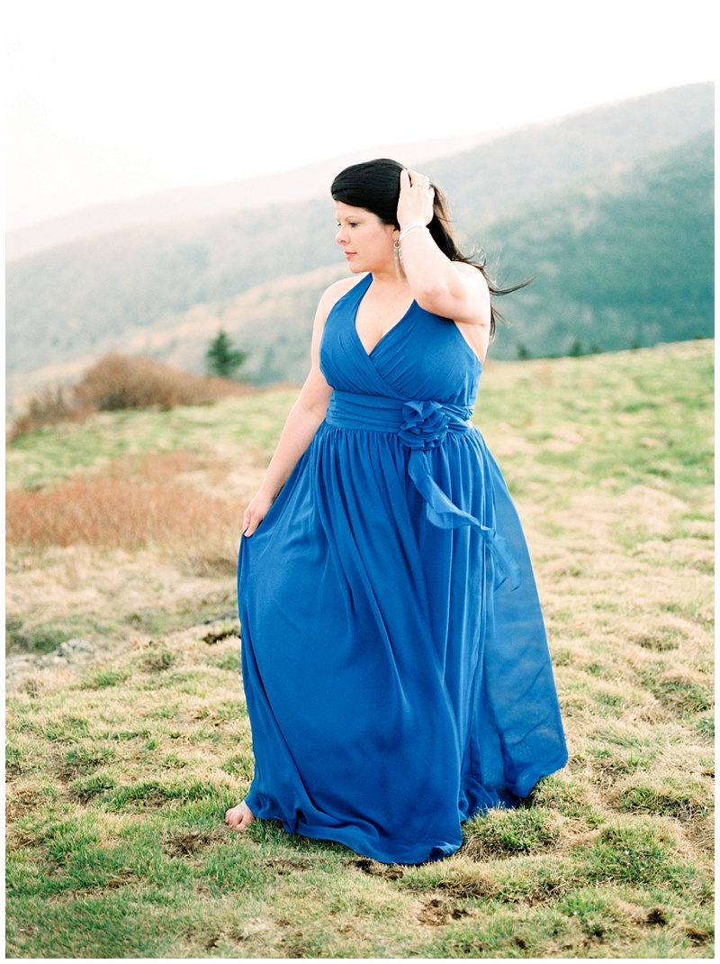 Roan Mountain engagement photos of joyful couple hiking together