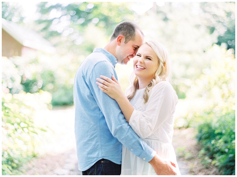 Couple laughing together during Roan Mountain engagement shoot