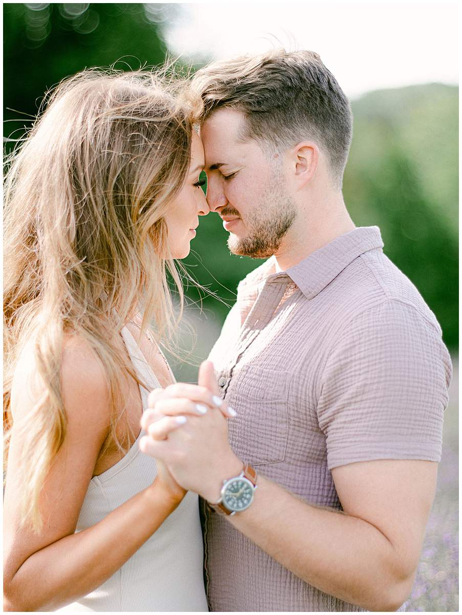 Candid engagement moments in blooming lavender fields in Abingdon VA
