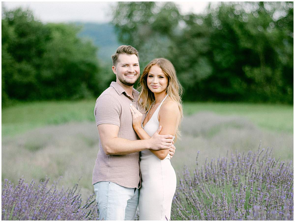 Couple walking through rows of lavender at Walnut Hills Lavender and Herb Farm
