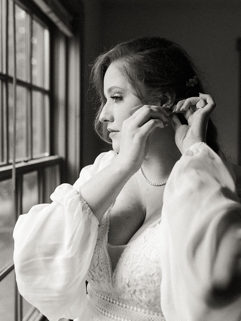 Stunning bridal portrait in black and white taken at her natural tunnel state park wedding