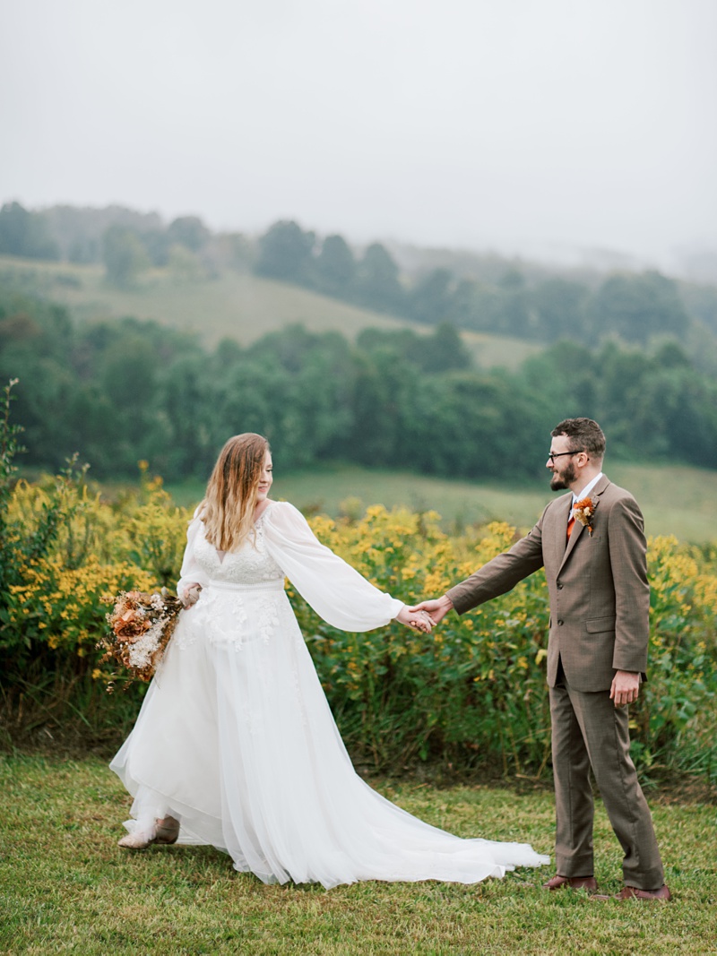 Wedding couple walking on forest trail