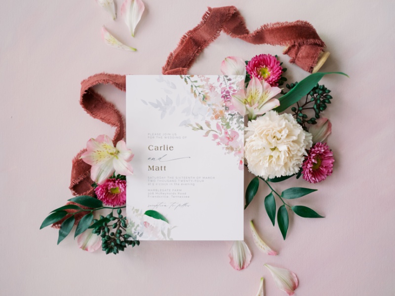 Wedding invitation suite on table