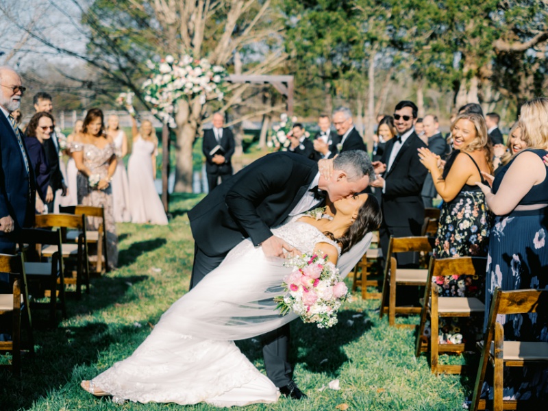 Bride and groom’s first kiss at Marblegate Farm