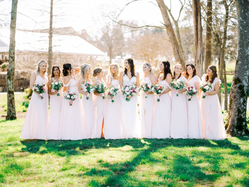 Bridesmaids laughing together outdoors