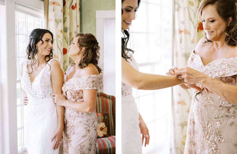 Bride and bridesmaids laughing while getting ready