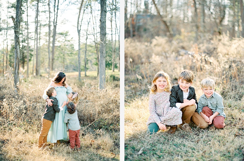 Children interacting with mom’s belly during photos Children interacting with mom’s belly during photos