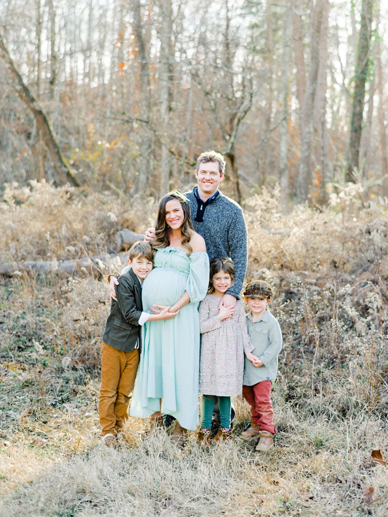 Family portrait with mom’s belly during photos Family portrait with mom’s belly during photos