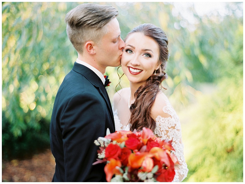 bride smiling at the camera on her wedding day