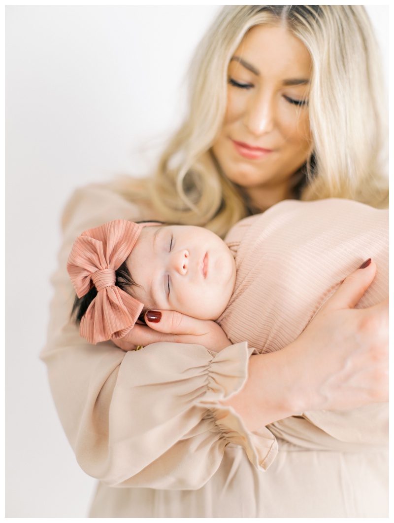 Parent holding newborn gently in Kingsport TN studio
