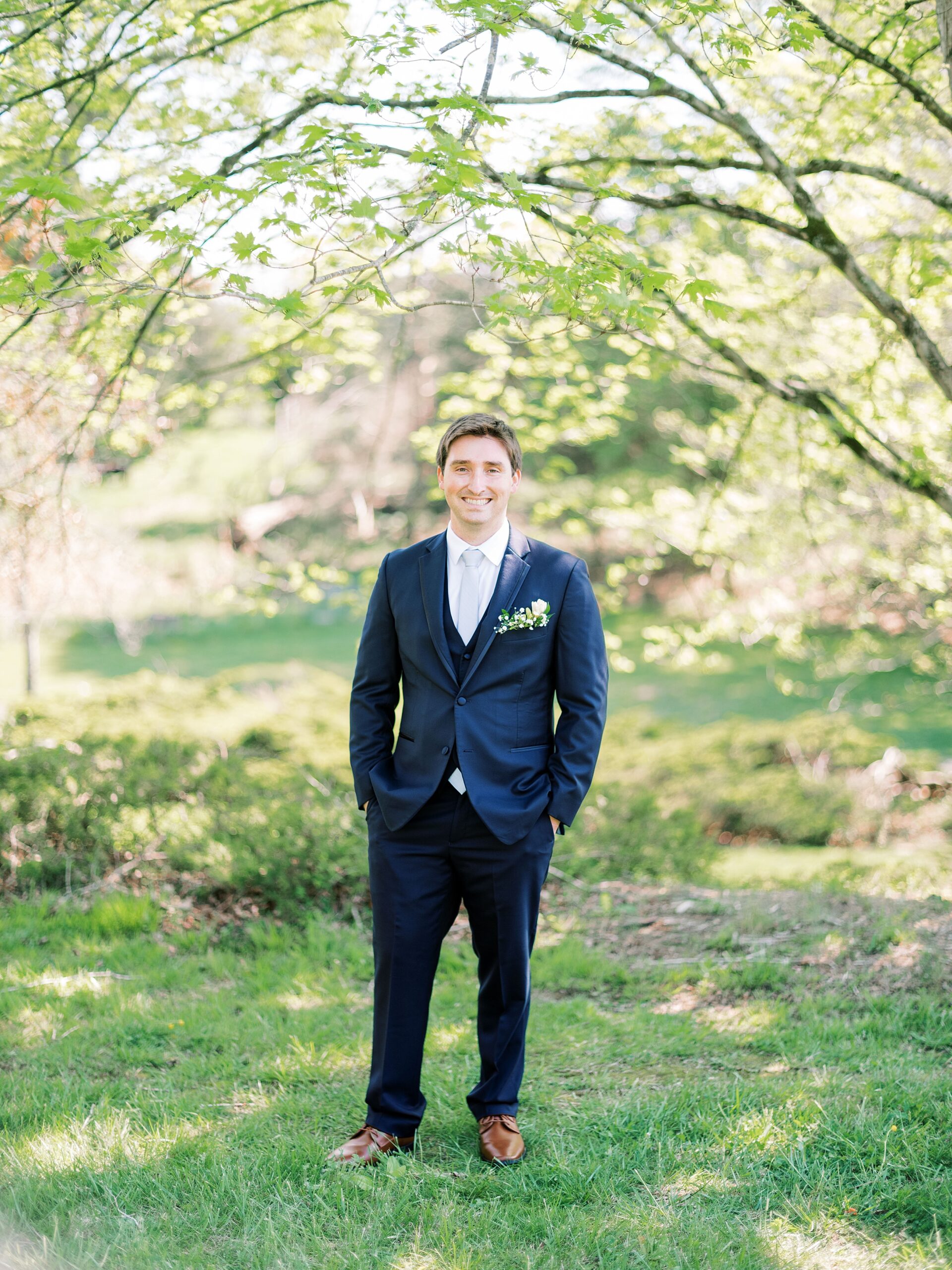 groom smiling portrait at Lake House wedding venue Boone Lake