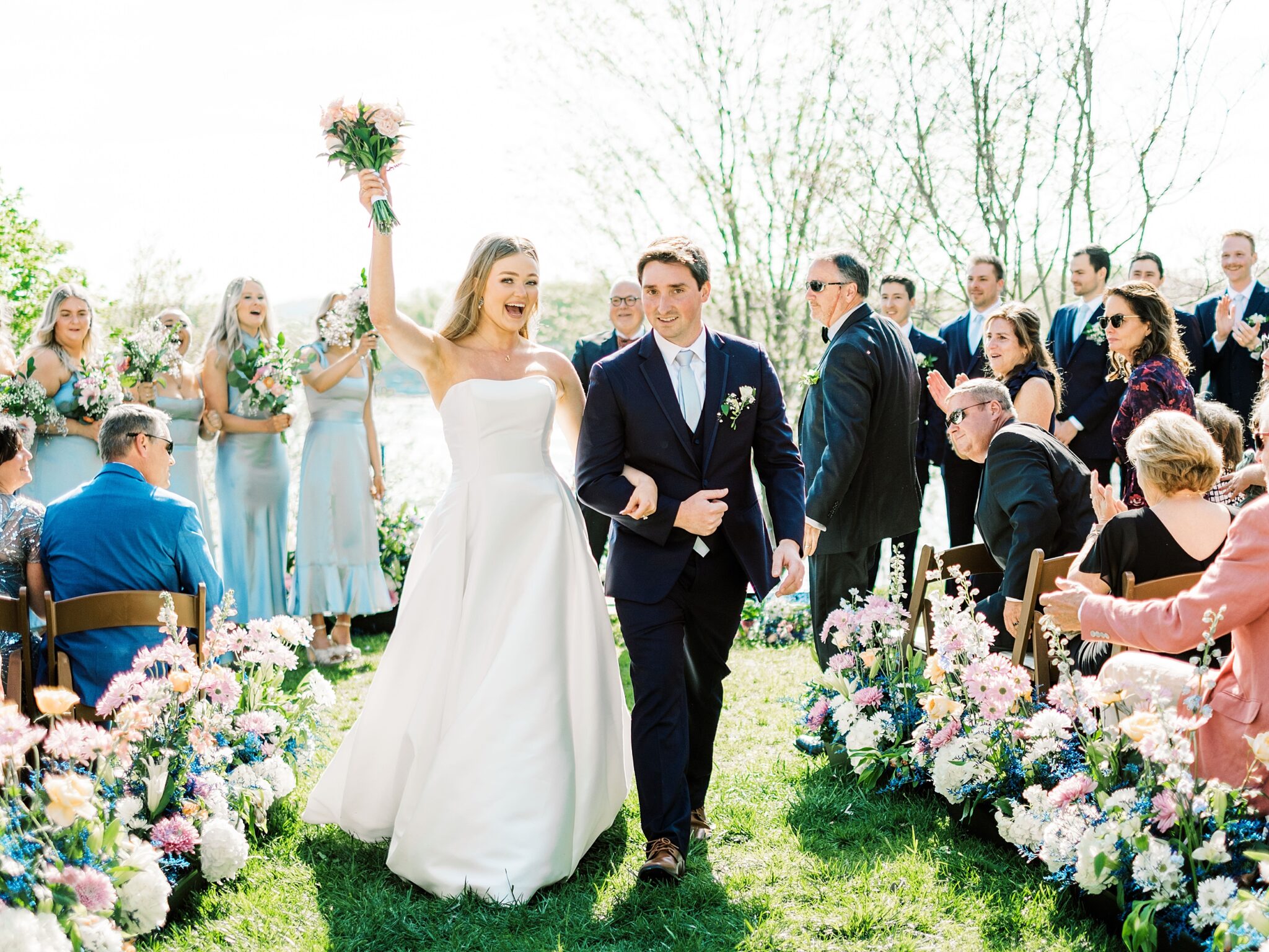 bride and groom holding hands at altar Lake House venue