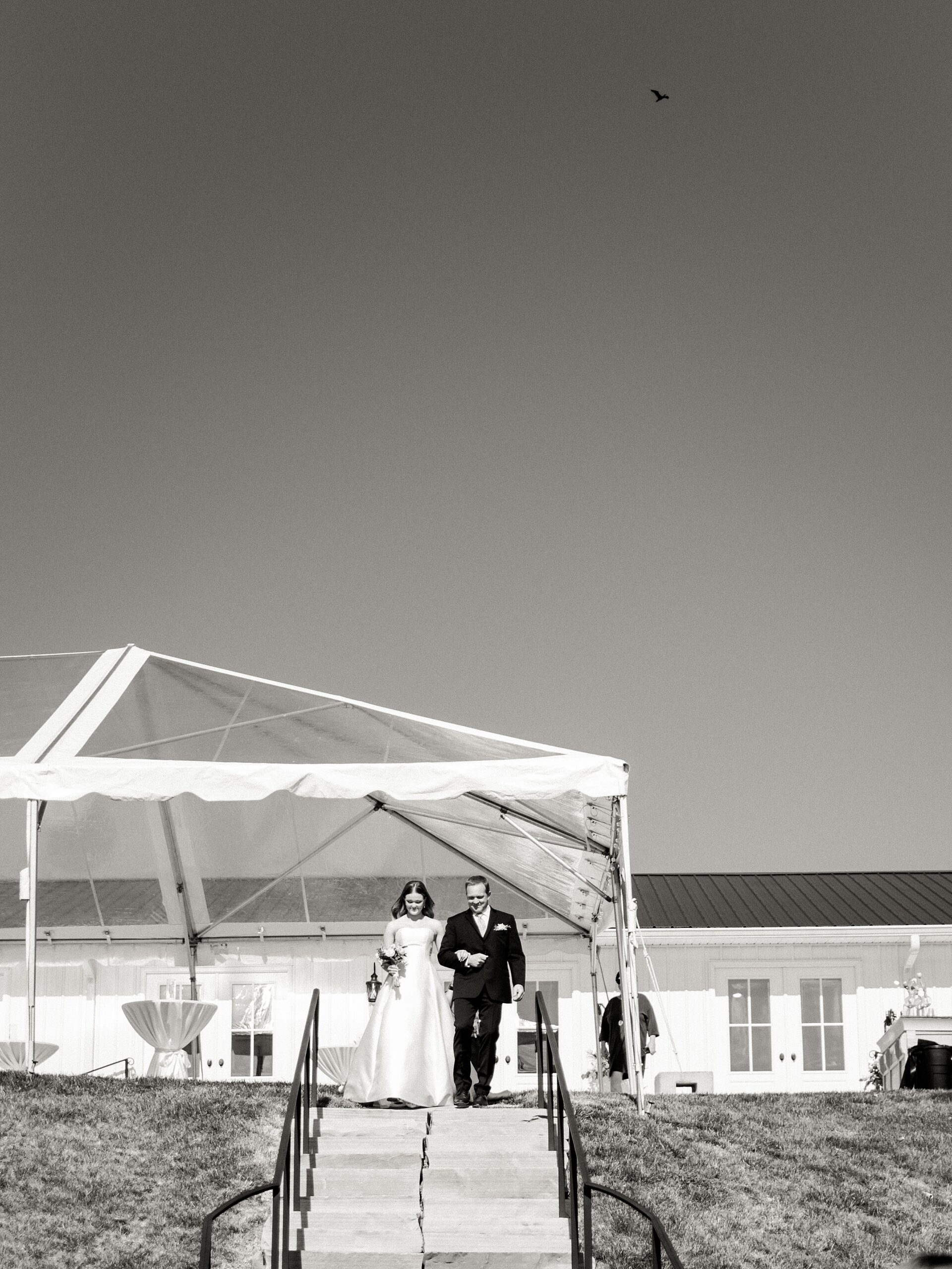bride walking down aisle at Lake House wedding venue