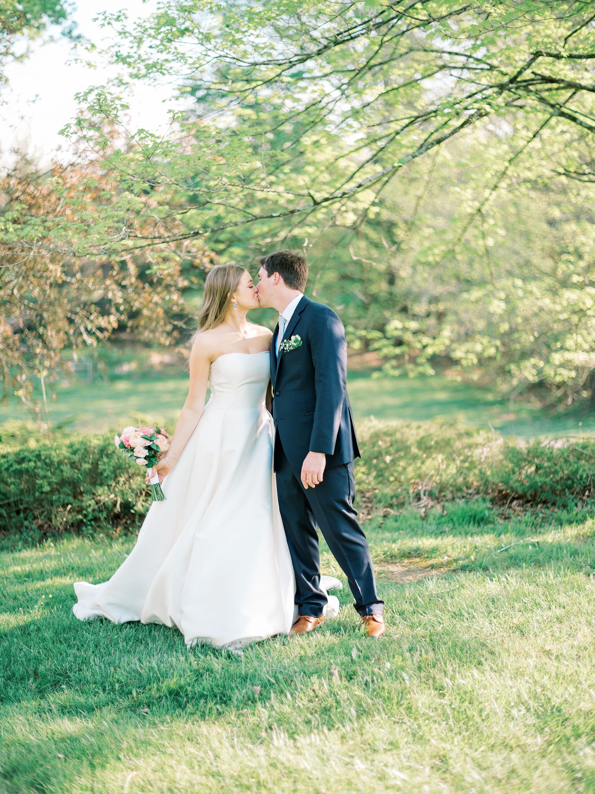 bride and groom holding hands at Lake House wedding venue TN