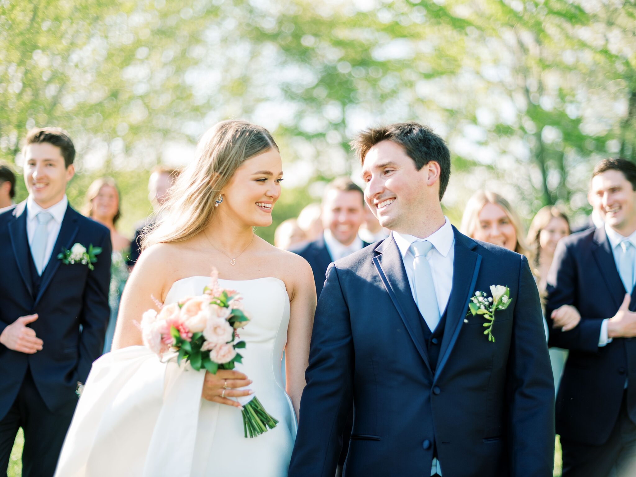 bridal party walking together at Lake House wedding venue Piney Flats