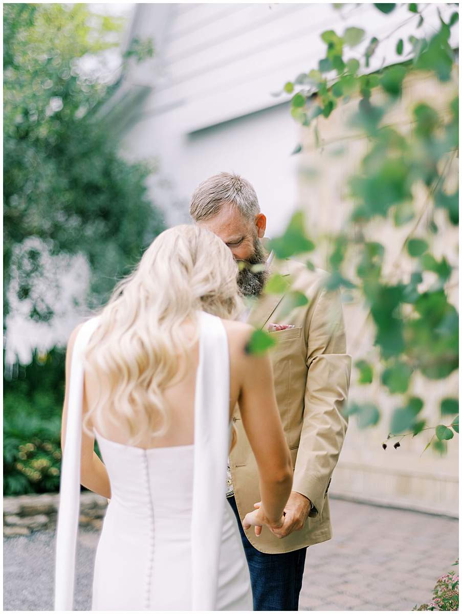 bride and father first look banner elk