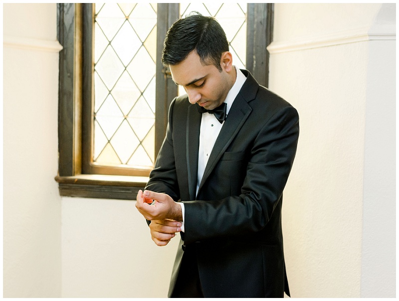 groomsmen helping groom jacket