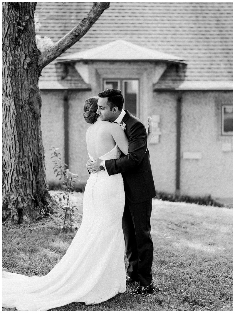 bride and groom hugging for the first time on their wedding day