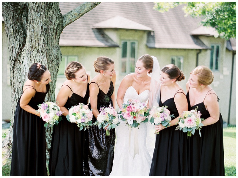 bridesmaids holding bouquets together