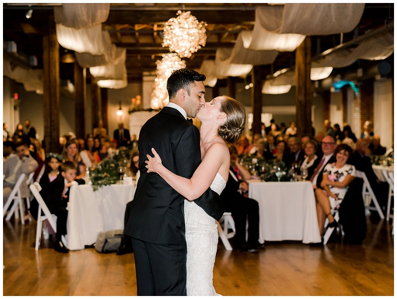 bride and groom dancing together at wedding reception